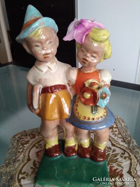 Figures of hoppy children, with a rare flower holder design on the little girl's head from the 1930s!