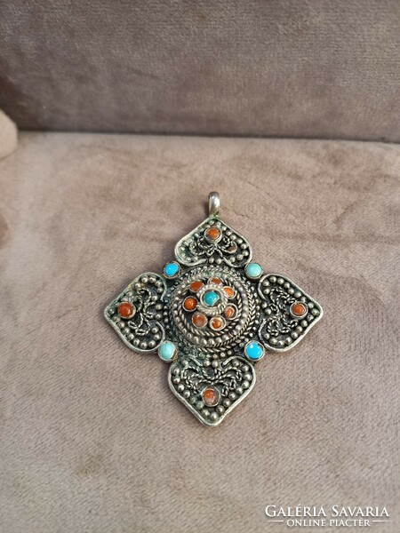 Antique Tibetan silver pendant with stones