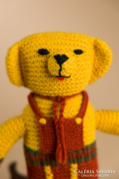 Retro knitted toy teddy bear.