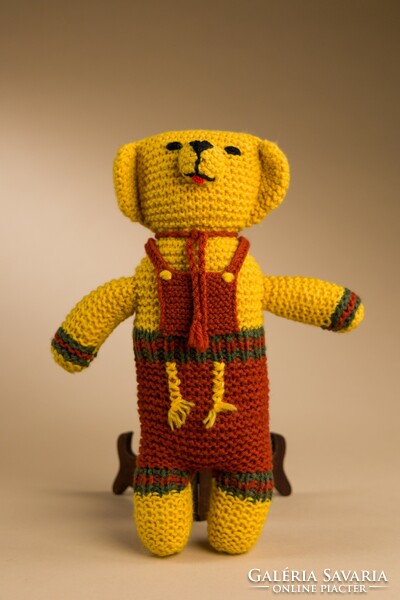 Retro knitted toy teddy bear.