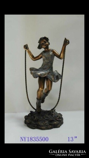 Bronzed statue of a little girl figure