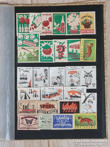 A collection of 120 old match tags arranged in an album