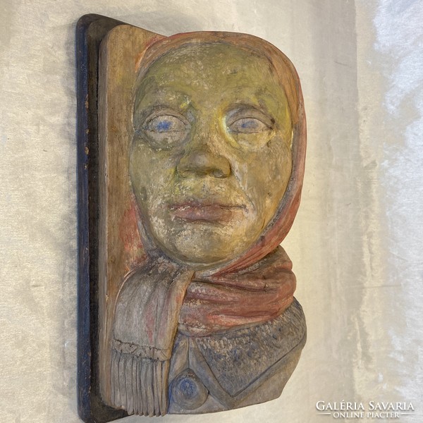 Antique female portrait made of wood