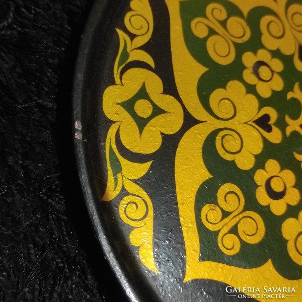 A beautiful painted decorative plate with a mandala pattern