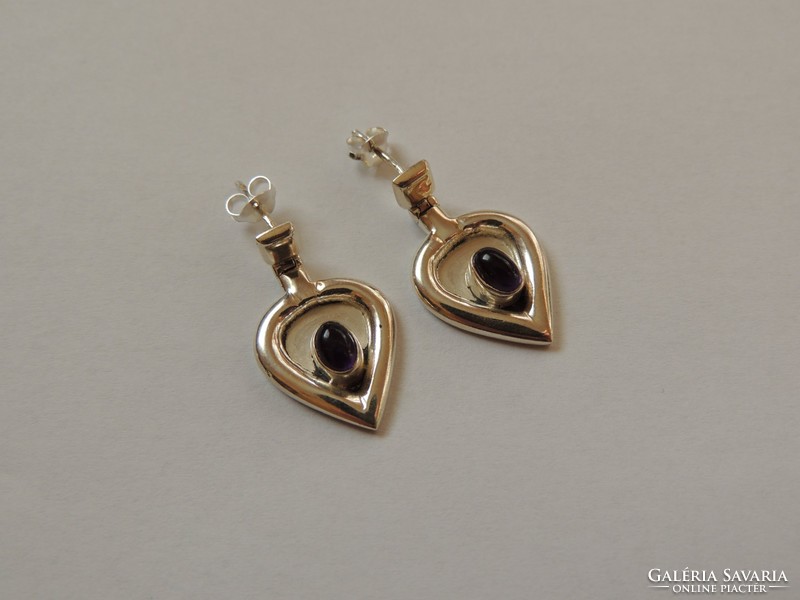 Unique designed silver earrings decorated with amethyst stone