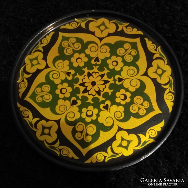 A beautiful painted decorative plate with a mandala pattern