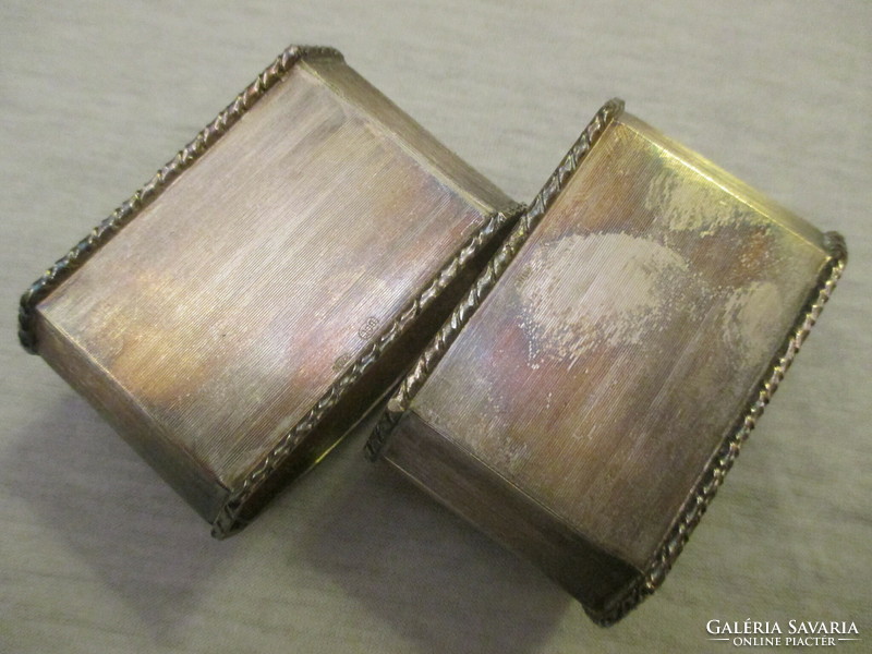 Pair of antique silver napkin rings with a gold medallion