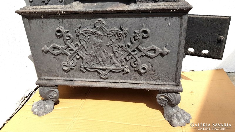 Antique 1870s hunting-scene two-story cast iron stove