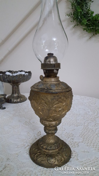 Old, angelic metal kerosene lamp with glass container