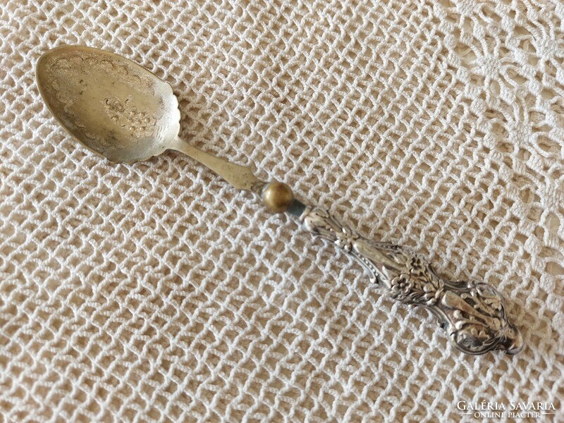 Old cutlery, a small spoon with a decorative handle
