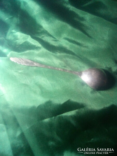 Old decorative metal dessert spoon