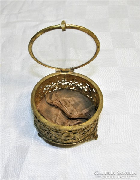 Antique openwork copper jewelry holder with glass lid.