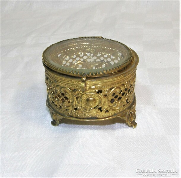 Antique openwork copper jewelry holder with glass lid.