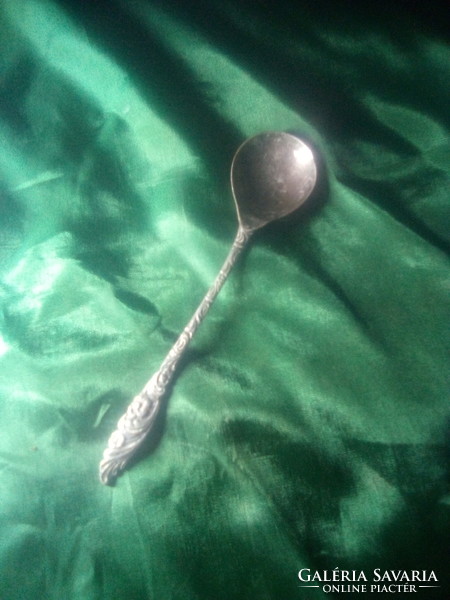 Old decorative metal dessert spoon