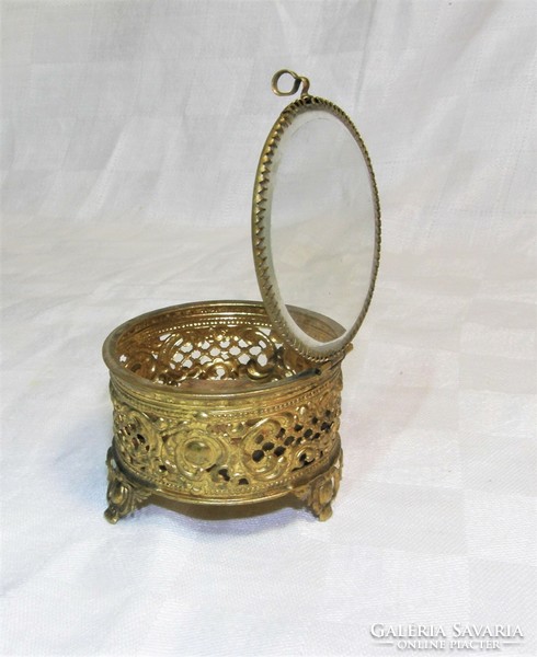 Antique openwork copper jewelry holder with glass lid.