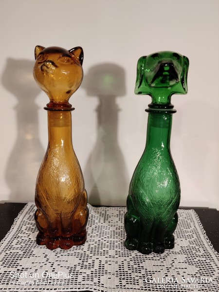 Molded glass bottles with animal figures are for sale
