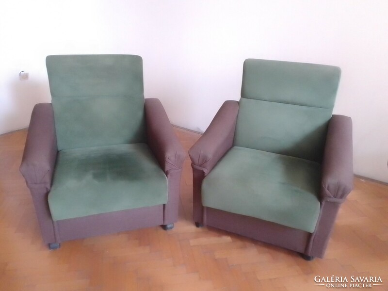 Two classically shaped, high-back two-color, dark brown, moss green armchairs with castors