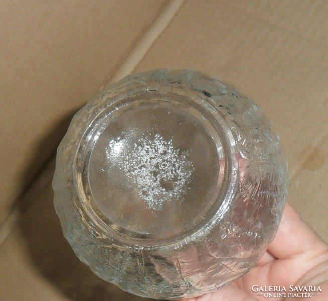 2 oil/vinegar bottles on an oval tupperware tray.