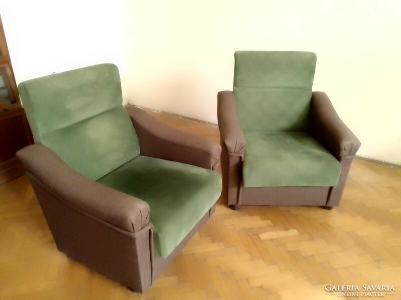 Two classically shaped, high-back two-color, dark brown, moss green armchairs with castors