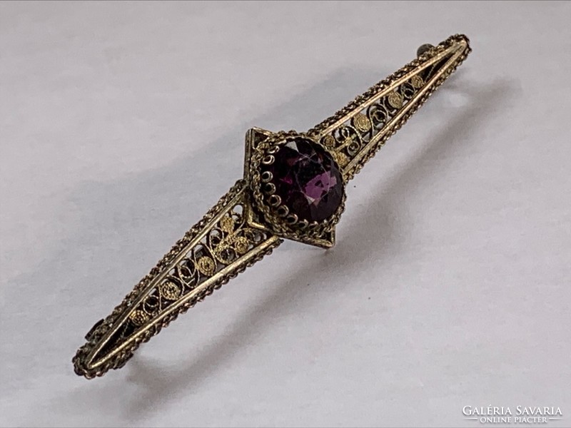 Antique silver-plated copper brooch with purple stone