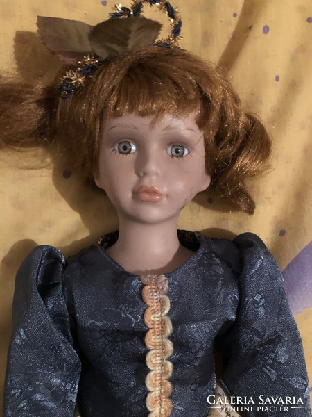 A beautiful doll with a porcelain head