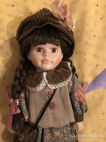 Porcelain head doll with full clothes