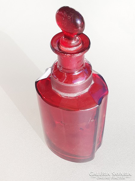 Antique ruby pharmacy bottle in purple pharmacy old stopper bottle