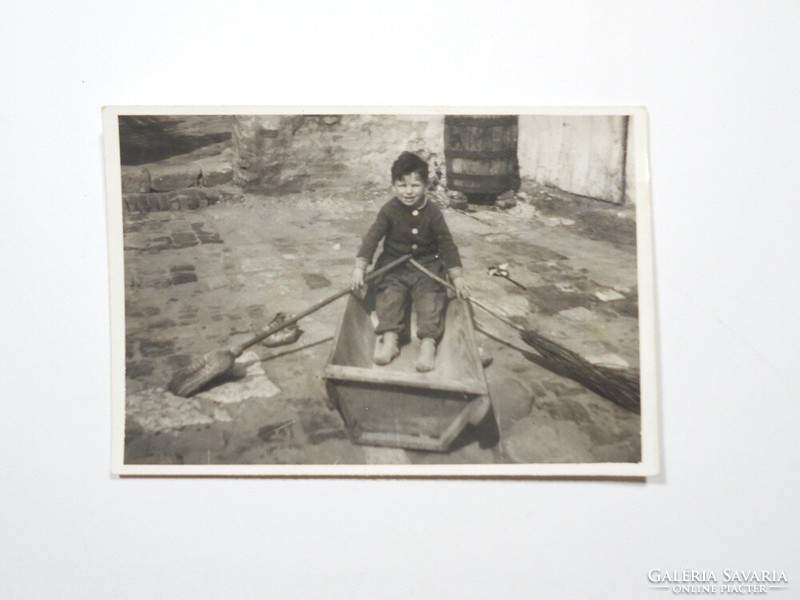 Old photo photograph - little boy child playing yard turtle broom rowing boat