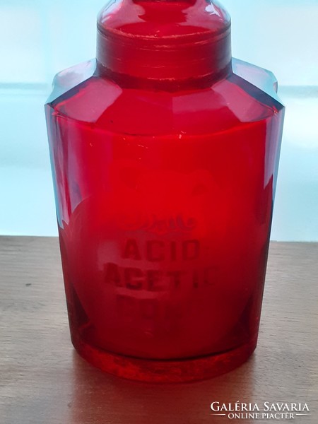 Antique ruby pharmacy bottle in purple pharmacy old stopper bottle