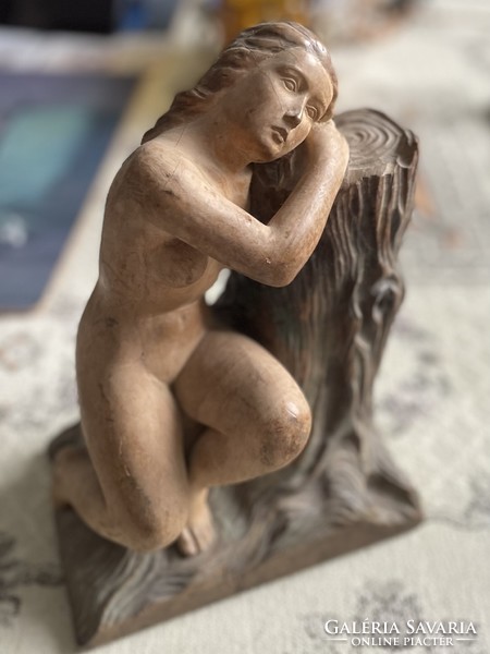 Carved statue of a resting nymph