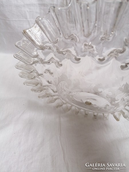 Antique lampshade with ruffled edges.