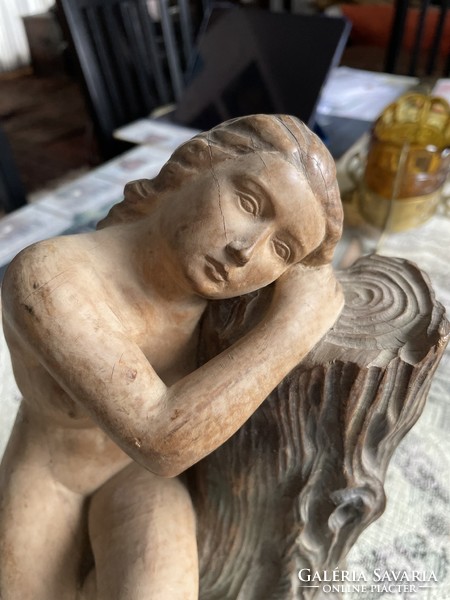 Carved statue of a resting nymph