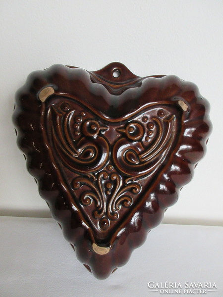 Old, numbered, heart-shaped, ceramic baking dish. Negotiable!