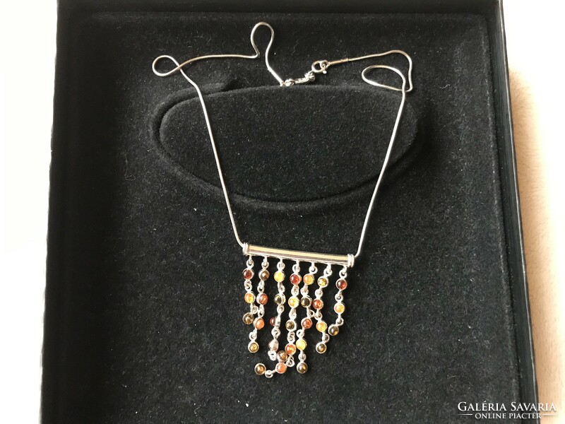 Silver necklaces with three colors of amber