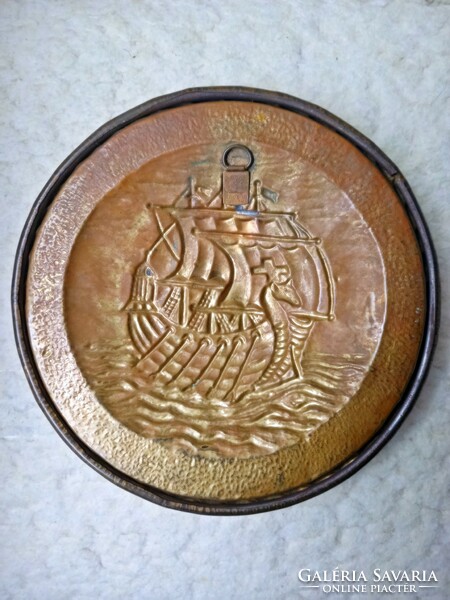 Copper decorative plate depicting a convex Viking ship