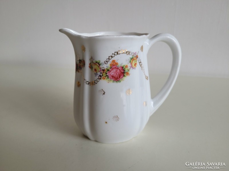 Old porcelain small jug with rose pattern, milk spout with flower garland