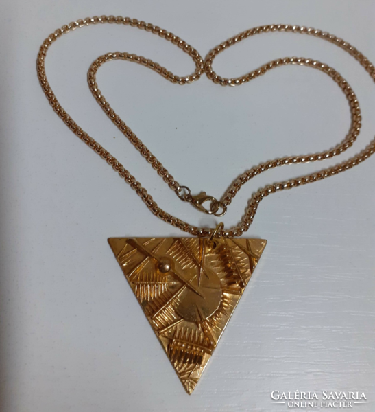 Marked applied arts gilt relief bronze triangle pendant on a gilt thick long chain