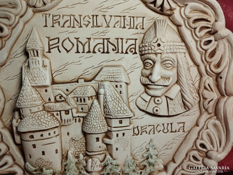 Dracula and his castle on a ceramic plate with a relief pattern