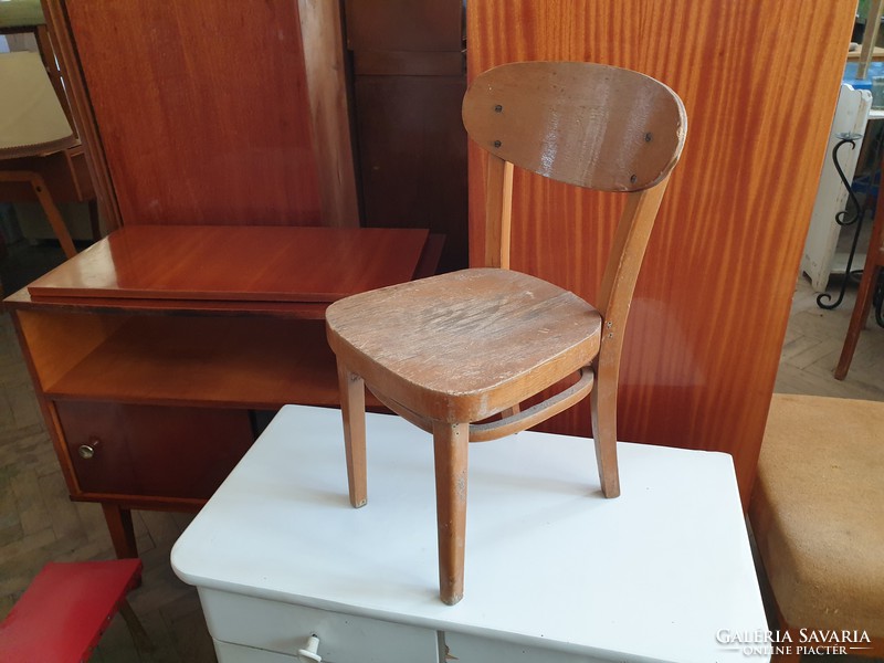 Old retro small wooden chair with vintage highchair