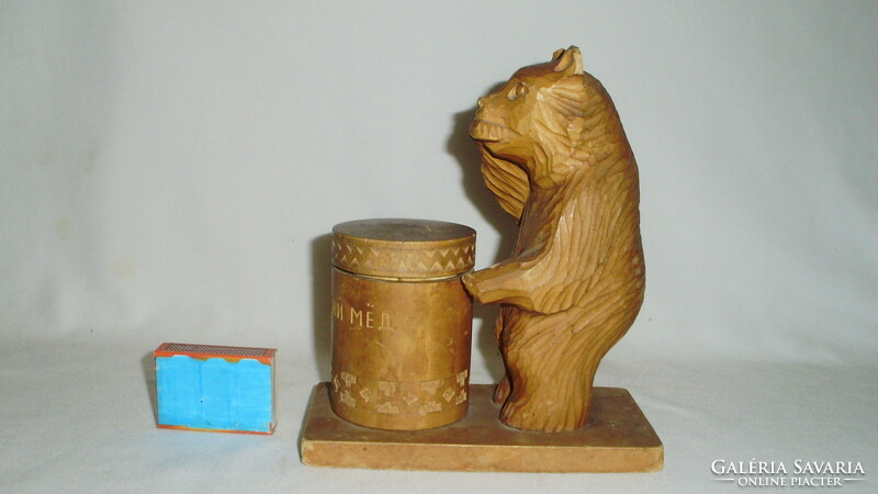 Old Russian carved wooden bear, teddy bear statue on honey pot with small storage