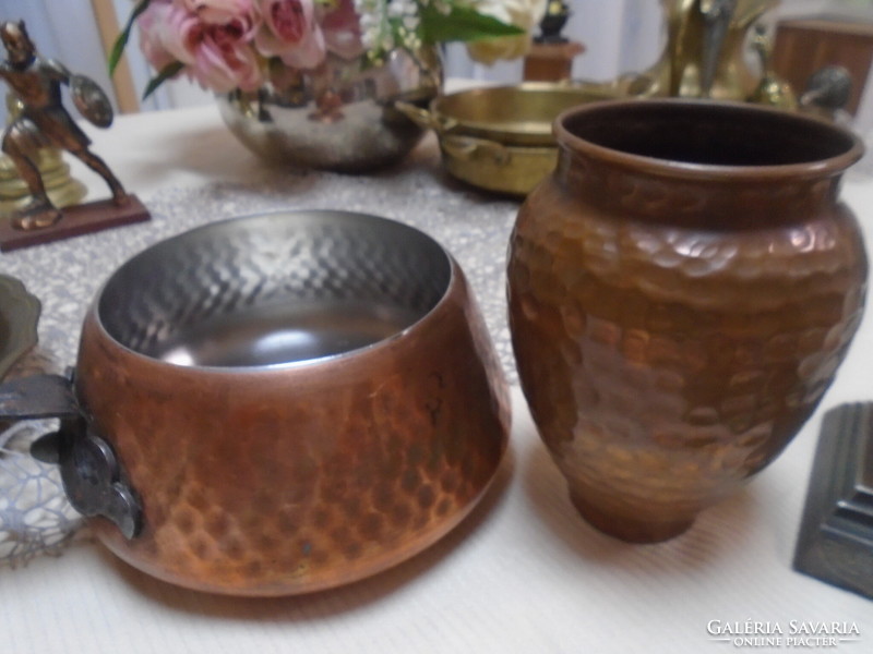 An old copper teapot with a handle and a vase, both with markings, in perfect condition