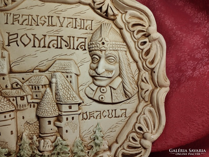 Dracula and his castle on a ceramic plate with a relief pattern