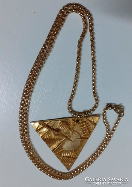 Marked applied arts gilt relief bronze triangle pendant on a gilt thick long chain