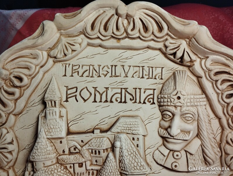 Dracula and his castle on a ceramic plate with a relief pattern