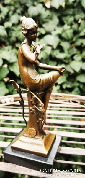 Art Nouveau bronze statue - woman with a bird in her hand