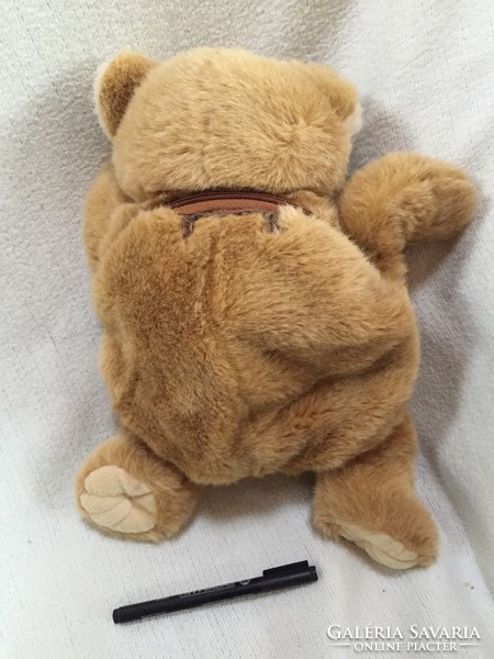 Teddy bear with medium brown, silky fur, opening pocket at the back