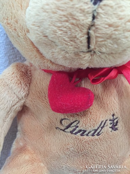 Lindt teddy bear, red bow with heart, opening pocket at the back
