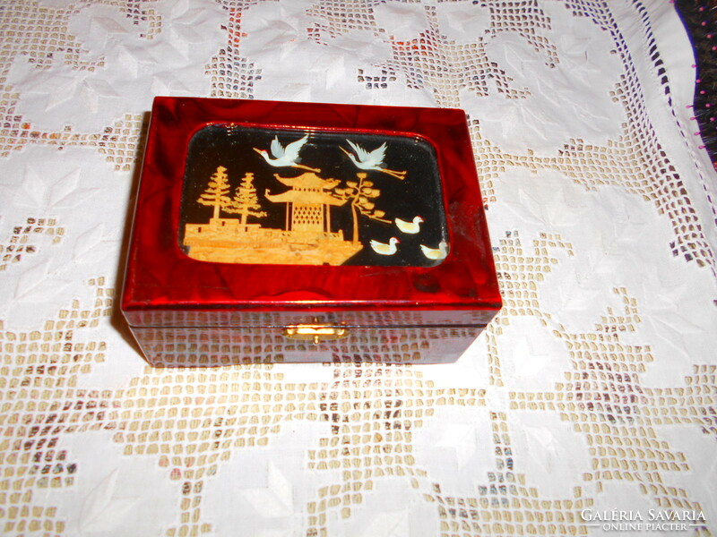 Musical lacquer box with a cork miniature insert on the top and a jewelry holder