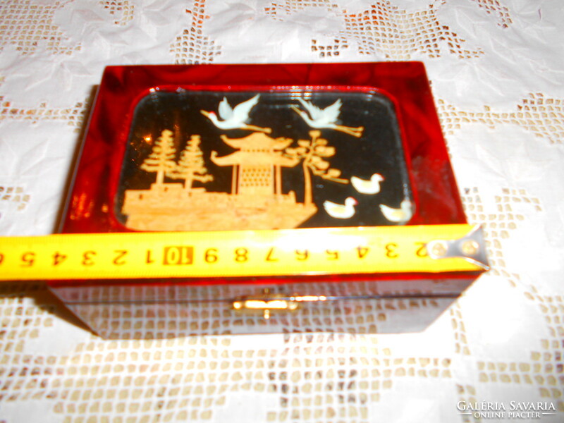 Musical lacquer box with a cork miniature insert on the top and a jewelry holder