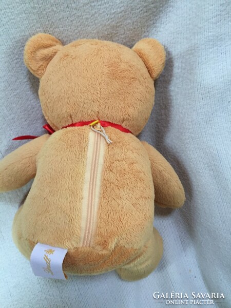Lindt teddy bear, red bow with heart, opening pocket at the back